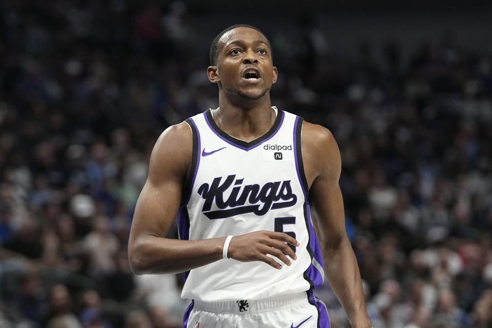 Sacramento Kings guard De'Aaron Fox runs up court after scoring during the first half of an NBA basketball game against the Dallas Mavericks in Dallas, Sunday, Nov. 19, 2023. (AP Photo/LM Otero)