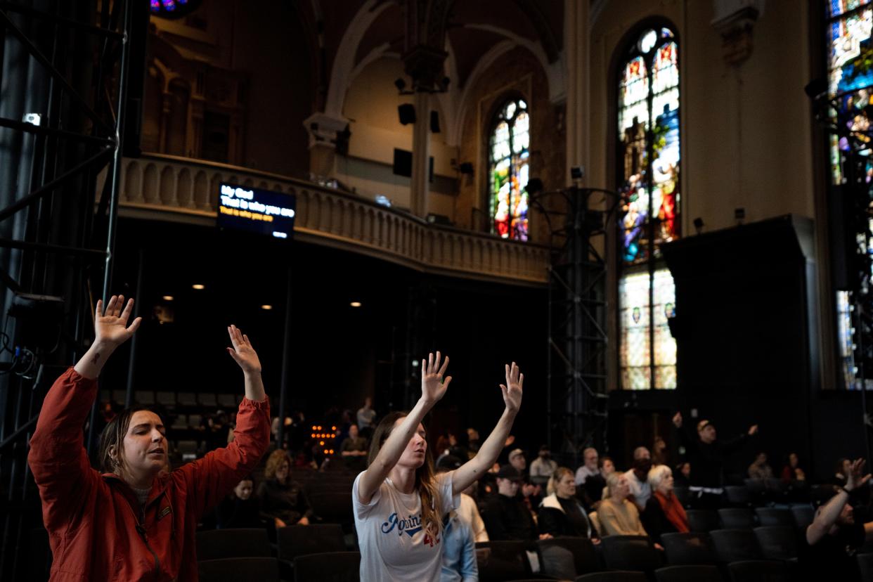 Crossroads Church is among the largest nondenominational churches in Greater Cincinnati and one reason why evangelical protestants now outnumber Catholics and mainline protestants in the region. Here, attendees pray at Crossroads Uptown in Clifton during a prayer service in 2023 for critically injured Buffalo Bills player Damar Hamlin.