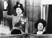 <p>Princess Elizabeth waves to the crowd next to her mother Queen Elizabeth. (Getty Images)</p> 