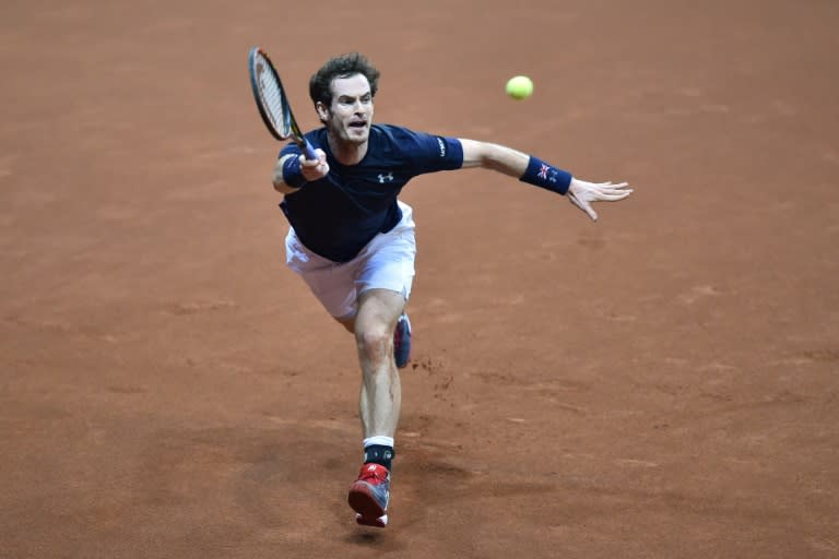 Britain's Andy Murray returns the ball to Belgium's Ruben Bemelmans during their tennis match on the first day of the Davis Cup final between Belgium and Britain at the Flanders Expo in Ghent on November 27, 2015