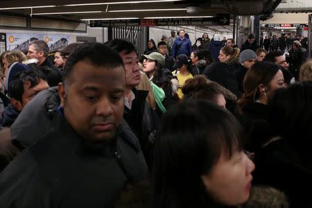 A crowd of New York City subway commuters gather at 34th St - Herald Square station after an explosion near the Port Authority Bus Terminal in Manhattan, New York, U.S., December 11, 2017. REUTERS/Amr Alfiky