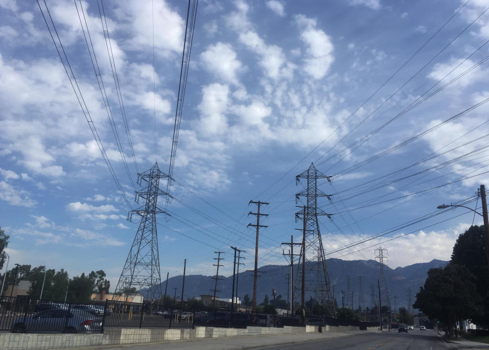 Electrical grid transmission towers are seen in Pasadena, California on August 15, 2020.  The operator of the state's power grid declared an emergency Friday evening, Aug. 14, and ordered utilities to shed their power loads. / Credit: John Antczak/AP