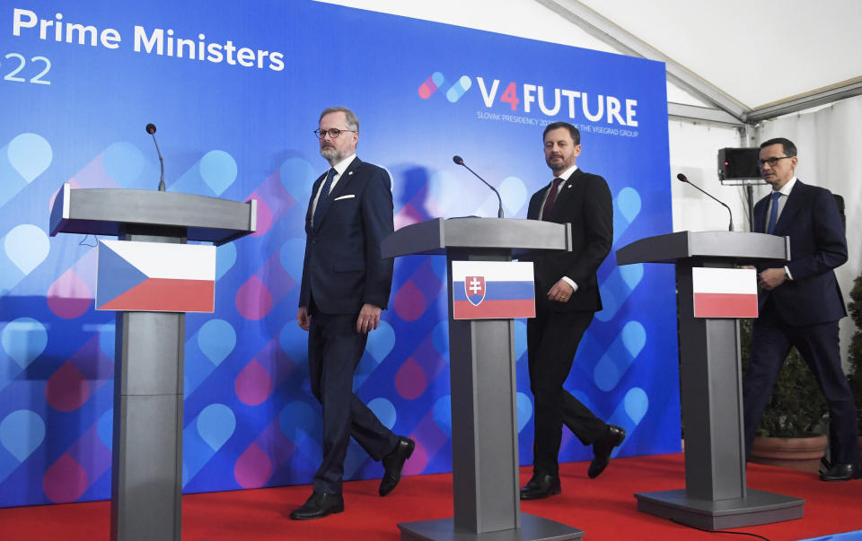 From left, Prime Ministers Petr Fiala of the Czech Republic, Eduard Heger of Slovakia and Mateusz Morawiecki of Poland arrive for a joint press conference after the summit of Visegrad Group (V4) prime ministers in Kosice, Slovakia, Thursday Nov. 24, 2022. (Frantisek Ivan/TASR via AP)