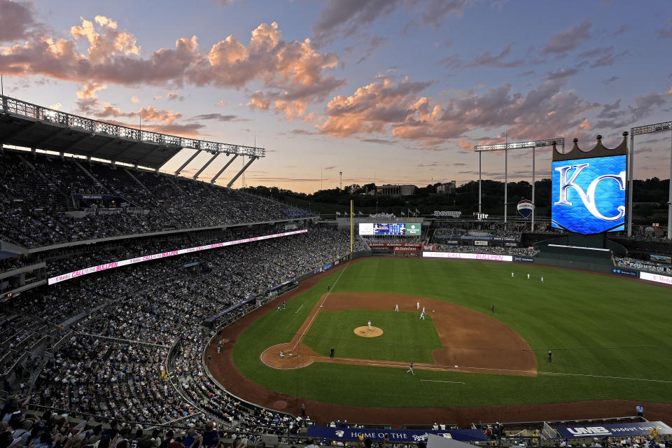 Fans watch during the fifth inning of a baseball game between the Kansas City Royals and the Tampa Bay Rays Thursday, July 4, 2024, in Kansas City, Mo. (AP Photo/Charlie Riedel)