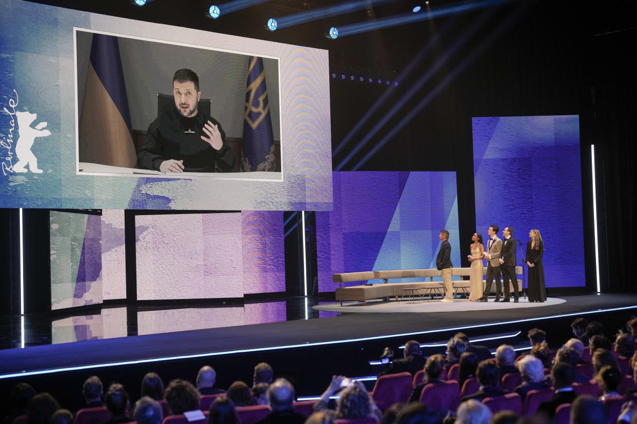 Ukrainian President Volodymyr Zelenskyy addresses the audience via video link during the opening ceremony at the International Film Festival Berlin 'Berlinale', in Berlin, Germany, Thursday, Feb. 16, 2023. (AP Photo/Markus Schreiber)