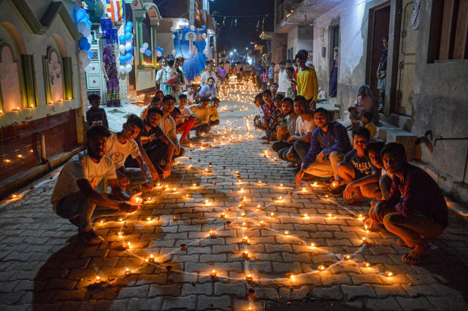 Meerut: A housing colony on Wednesday, 14 April, celebrates Ambedkar Jayanti by lighting earthen lamps.