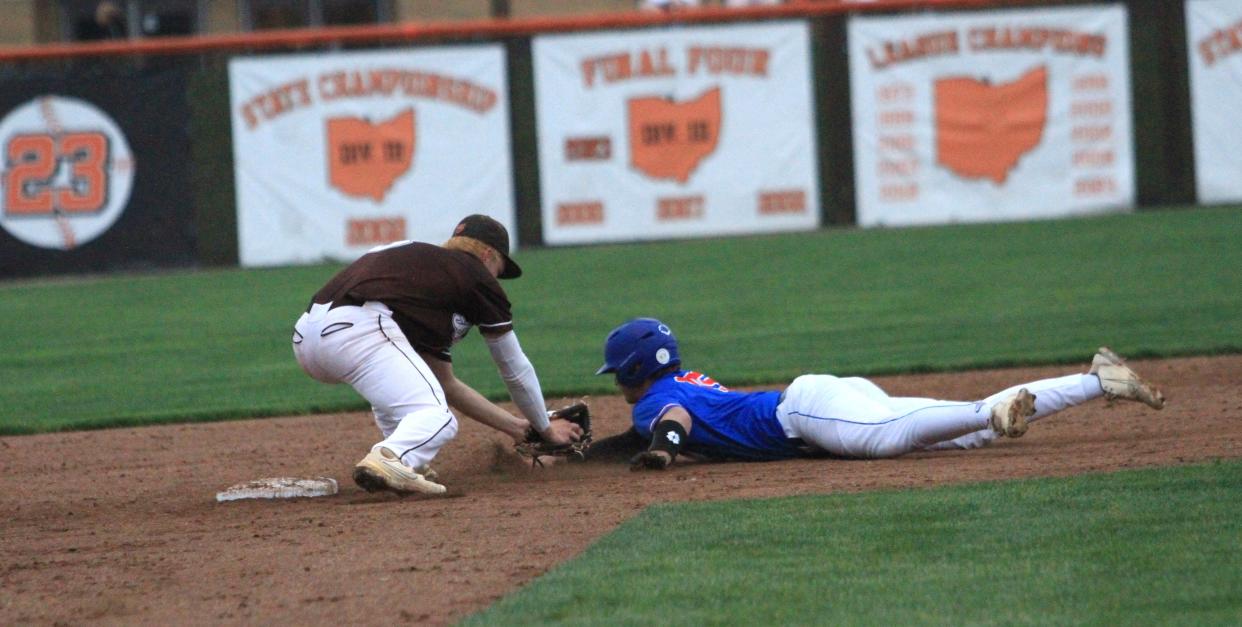 Heath's Tannar Patterson tags out Licking Valley's Aidan Harrold at second base during the host Bulldogs' 13-2 victory at Dave Klontz Field on Monday, May 6, 2024.