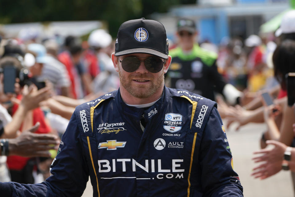 FILE - Conor Daly is introduced before the IndyCar Detroit Grand Prix auto race in Detroit, June 4, 2023. Daly, a 32-year-old Indy native from a racing family, will try to make his 11th start in the 500 on May 26, 2024, after driving for Ed Carpenter Racing in the last four 500s. (AP Photo/Paul Sancya, File)