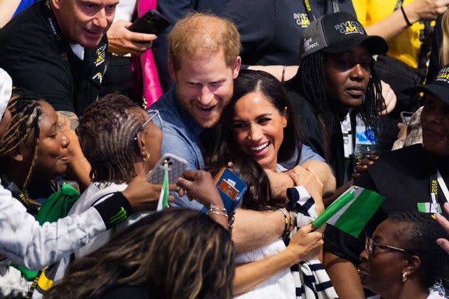 <p>Rolf Vennenbernd/picture alliance via Getty </p> (Center) Prince Harry and Meghan Markle at the Invictus Games in Dusseldorf, Germany on Sept. 14, 2023.