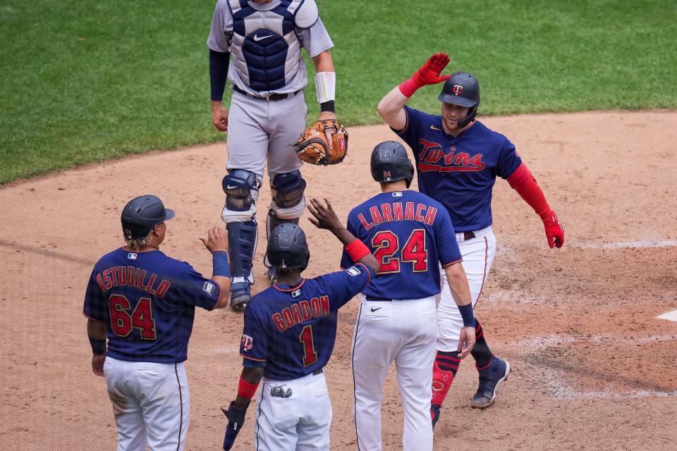 Minnesota Twins catcher Ryan Jeffers (27) celebrates his grand slam with his team July 28, 2021 against the Detroit Tigers in the fourth inning at Target Field in Minneapolis.