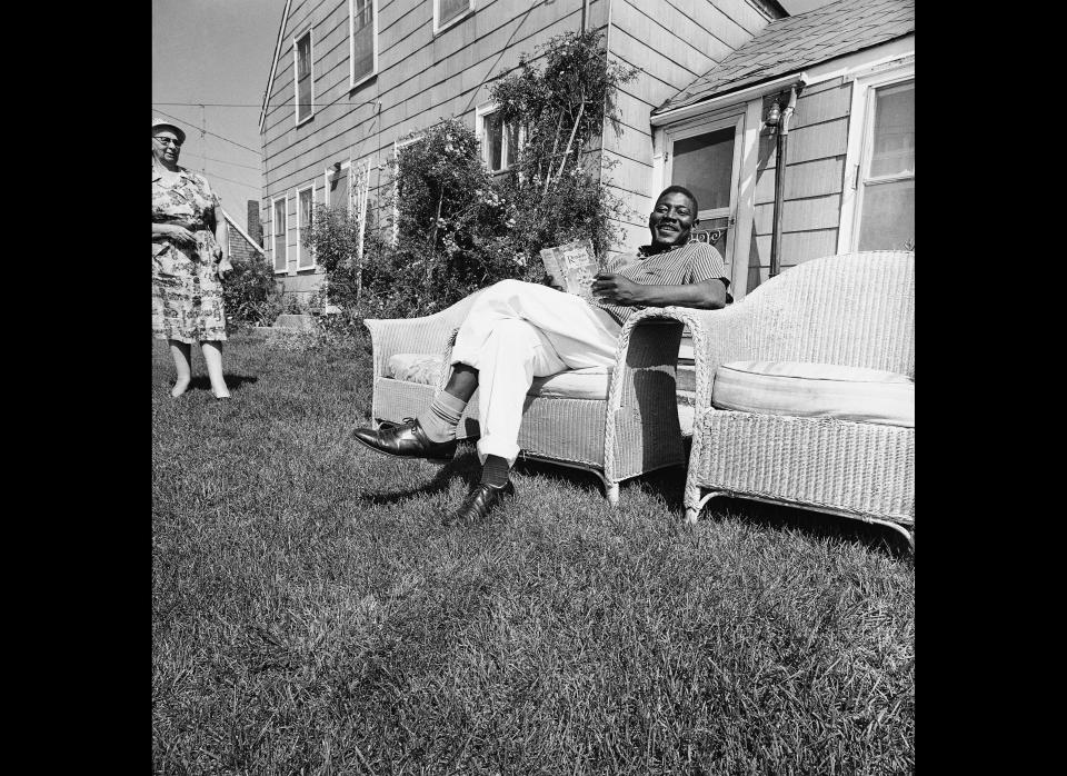 David Harris, the first reverse freedom rider to arrive in Hyannis from Little Rock, Ark., relaxes on lawn of home where he lives in this resort town, July 14, 1962. Since arriving here in May he has worked as a cook in a restaurant and opened his own little restaurant and has no complaints. (Frank C. Curtin, AP)