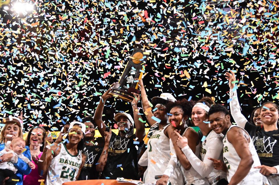Baylor teammates hoist the trophy after defeating Notre Dame to win the championship game of the women's Final Four of the 2019 NCAA Tournament.