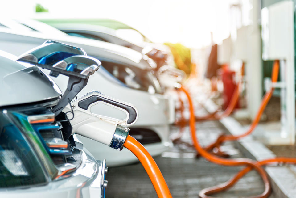 Electric cars are charging in station.