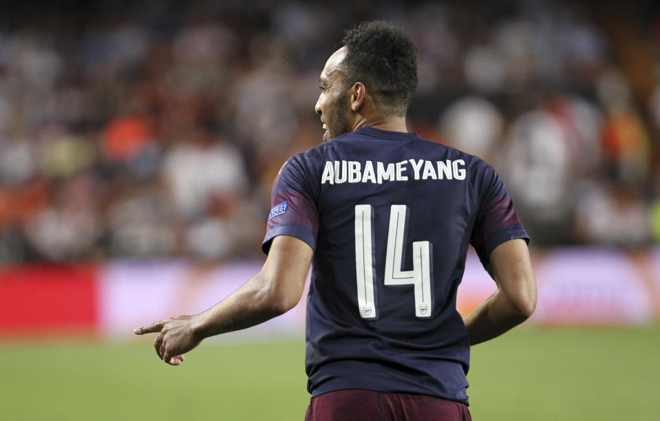 Arsenal forward Pierre-Emerick Aubameyang celebrates after scoring his side's third goal during the Europa League semifinal soccer match, second leg, between Valencia and Arsenal at the Camp de Mestalla stadium in Valencia, Spain, Thursday, May 9, 2019. (AP Photo/Alberto Saiz)