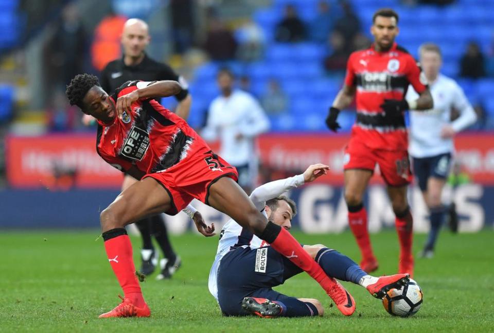 Huddersfield Town’s Terence Kongolo, left, gets stuck in during the Terriers’ Third Round FA Cup match against Bolton Wanderers.