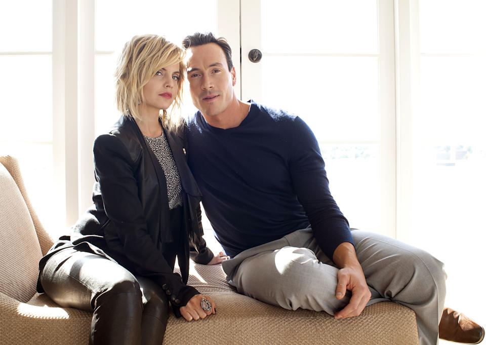 In this March 18, 2012 photo, actress Mena Suvari, left, and actor Chris Klein pose for a portrait during a media day for the upcoming feature film "American Reunion" in Los Angeles. The film opens nationwide on Friday, April 6. (AP Photo/Dan Steinberg, file)