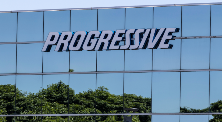 An image of the Progressive Corporation (PGR) logo displayed on a glass building