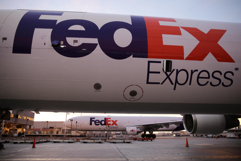 In this Monday, Dec. 2, 2013, file photo FedEx cargo planes sit on the tarmac outside the FedEx hub at Los Angeles International Airport on Monday, Dec. 2, 2013, in Los Angeles. The CEO of FedEx, Fred Smith, said Wednesday, Dec. 18, 2013, that FedEx has several drone studies underway, but the idea of delivering items by drone is “almost amusing.” (AP Photo/Jae C. Hong)