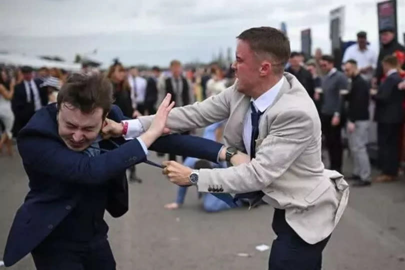 Fighting breaks out on Ladies Day at the Grand National -Credit:SCARFF/AFP via Getty Images