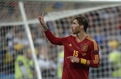 Spanish defender Sergio Ramos celerbates after scoring during the penalty shoot out of the Euro 2012 football championships semi-final match Portugal vs Spain at the Donbass Arena in Donetsk. Spain reached their third consecutive major tournament final after overcoming neighbours Portugal 4-2 on penalties in the first Euro 2012 semi-final in Donetsk on Wednesday