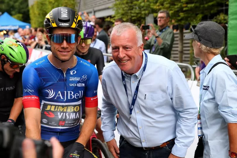 WARRINGTON, ENGLAND - SEPTEMBER 09: (L-R) Wout Van Aert of Belgium and Team Jumbo - Visma blue leader jersey and Andy Bell of United Kingdom AJ Bell CEO prior to 17th Tour of Britain 2021, Stage 5 a 152,2km stage from Alderley Park to Warrington / @TourofBritain / #TourofBritain / on September 09, 2021 in Warrington, England. (Photo by Alex Livesey/Getty Images)