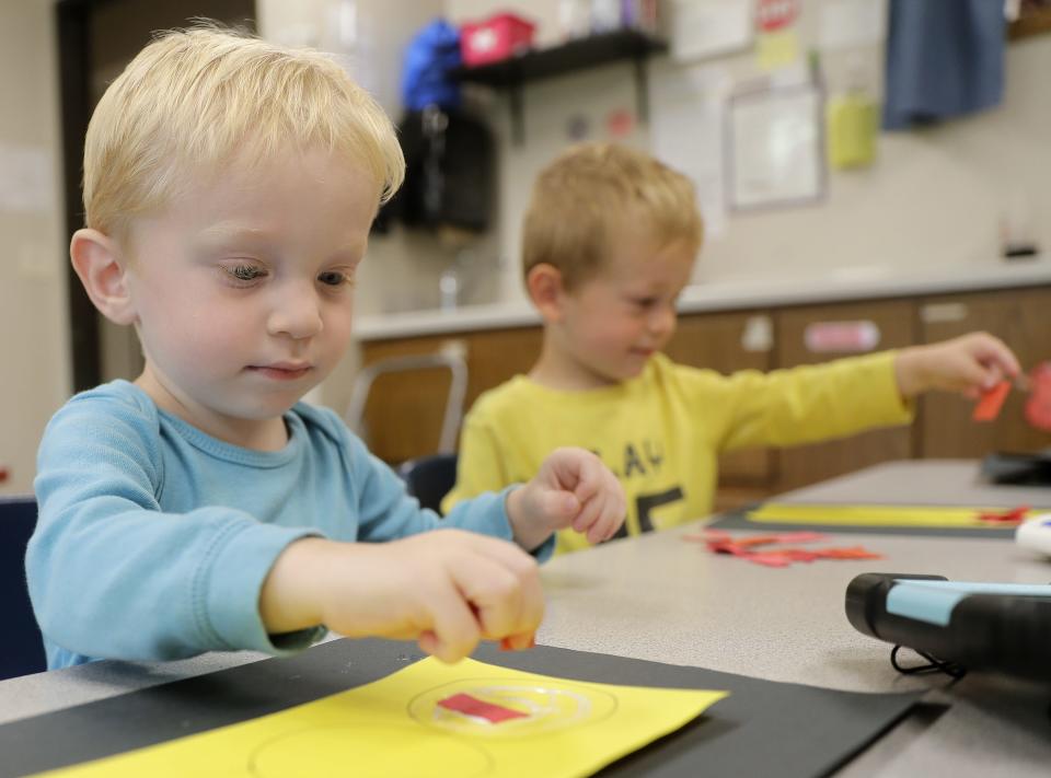 Twins Cole, left, and Caleb Persons work on an art project at Lily Pad Learning Center on Wednesday, September 20, 2023, in Fond du Lac.