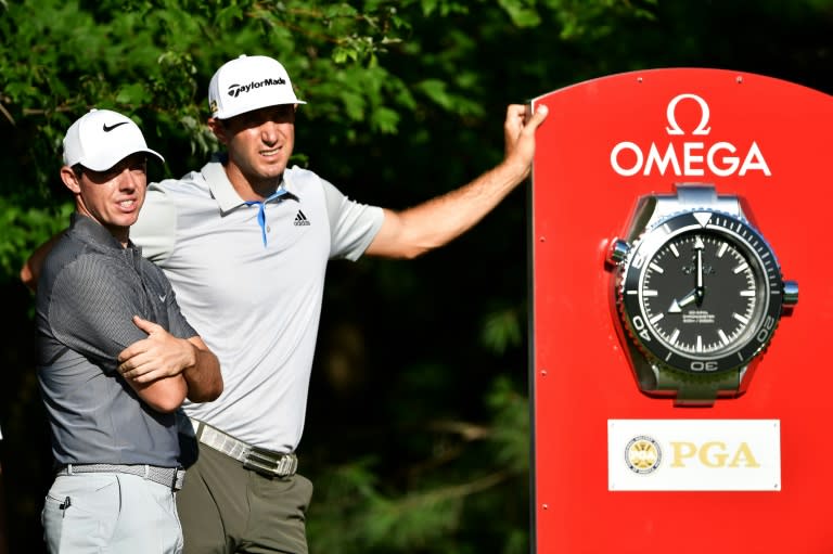 Rory McIlroy of Northern Ireland and Dustin Johnson of the United States wait on the tenth tee during a practice round prior to the 2016 PGA Championship at Baltusrol Golf Club on July 27, 2016 in Springfield, New Jersey