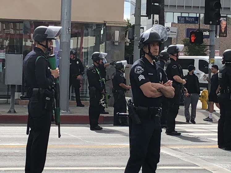 LAPD officers watch a peacerful protest at Van Nuys Blvd Monday, June 1, 2020.