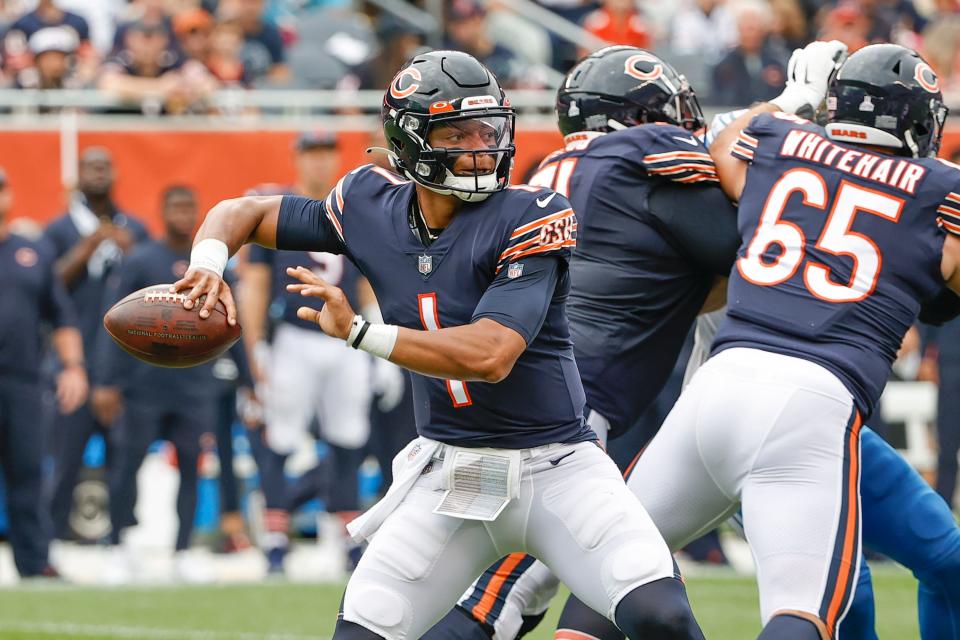 Chicago Bears quarterback Justin Fields looks to pass during the first half against the Detroit Lions.