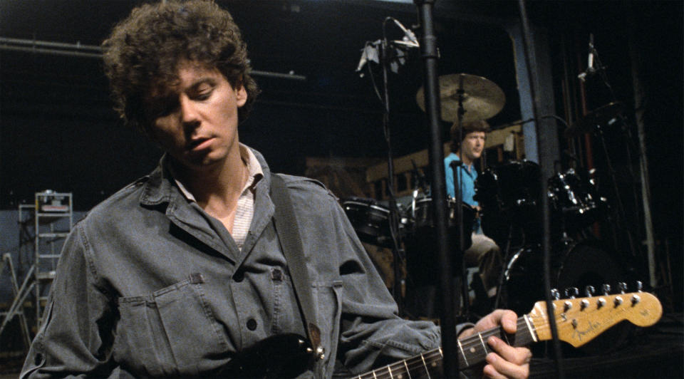This image released by A24 shows Jerry Harrison, left, and Chris Frantz in a scene from "Stop Making Sense." (Jordan Cronenweth/A24 via AP)