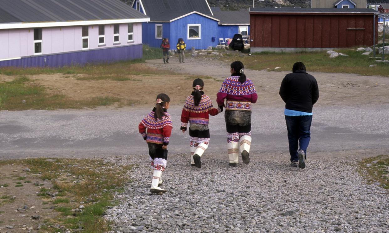 <span>An Inuit mother and girls in traditional costume in Qeqertarsuaq, Greenland, in 2010.</span><span>Photograph: Veronique Durruty/Gamma-Rapho/Getty Images</span>