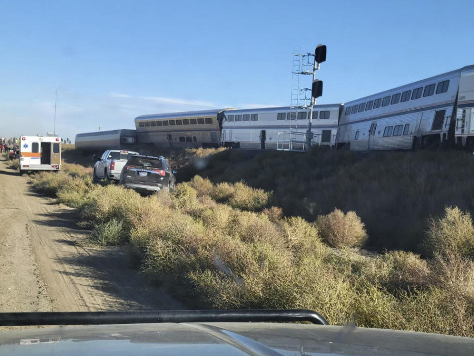 In this photo provided by Kimberly Fossen an ambulance is parked at the scene of an Amtrak train derailment on Saturday, Sept. 25, 2021, in north-central Montana. / Credit: Kimberly Fossen / AP