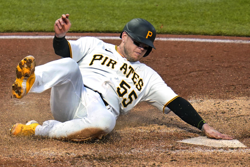 Pittsburgh Pirates' Roberto Perez scores on a double by Josh VanMeter off San Diego Padres starting pitcher Sean Manaea during the fifth inning of a baseball game in Pittsburgh, Saturday, April 30, 2022. (AP Photo/Gene J. Puskar)