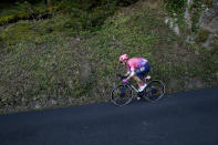 Neilson Powless of the US speeds down the Anglards de Salers pass during the stage 13 of the Tour de France cycling race over 191 kilometers from Chatel-Guyon to Puy Mary, Friday, Sept. 11, 2020. (AP Photo/Christophe Ena)