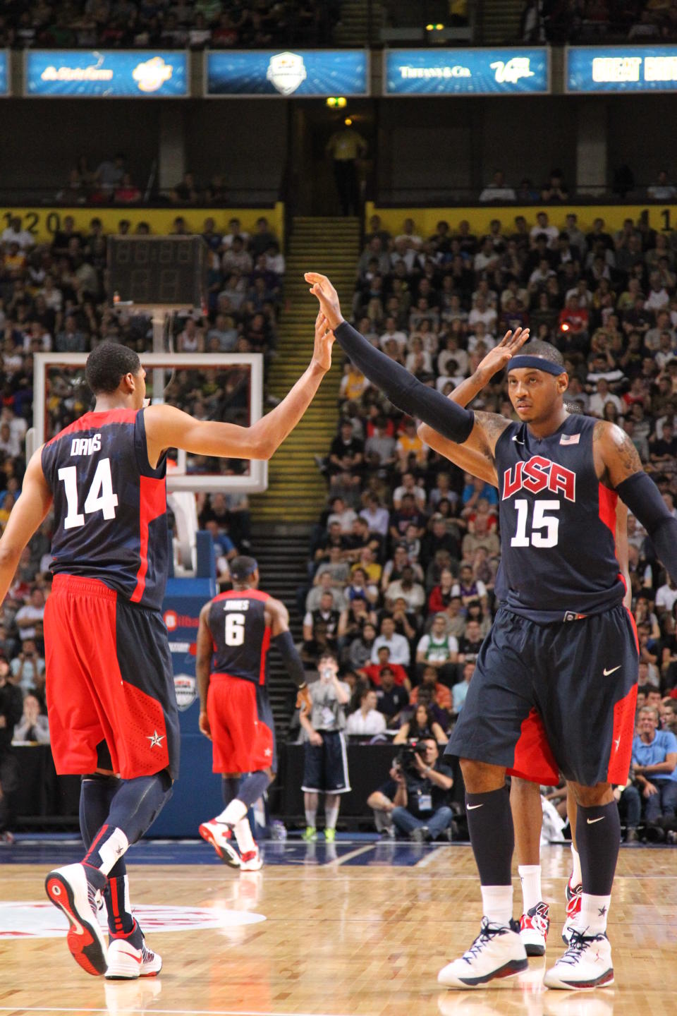 MANCHESTER, UK - JULY 19: Carmelo Anthony #15 and Anthony Davis #14 of the 2012 US Men's Senior National Team high five each other during an exhibition game against Great Britain's Men's team at the Manchester Arena on July 19, 2012 in Manchester, UK.