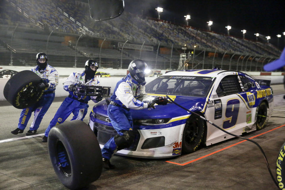 Chase Elliott makes a pit stop during the NASCAR Cup Series auto race Wednesday, May 20, 2020, in Darlington, S.C. (AP Photo/Brynn Anderson)