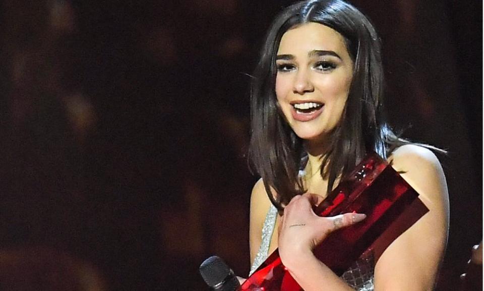 Dua Lipa is awarded best female solo artist at the Brit Awards in London on 21 February.