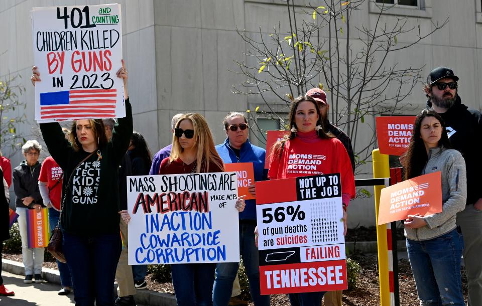 Demonstrators protest against gun violence in front of the Cordell Hull Building Tuesday, March 28, 2023, in Nashville, Tenn., after mass shooting Monday at Covenant School. 