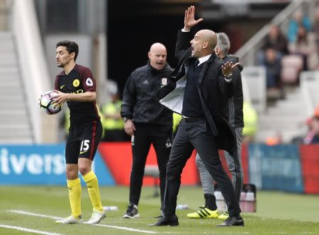 Britain Football Soccer - Middlesbrough v Manchester City - Premier League - The Riverside Stadium - 30/4/17 Manchester City manager Pep Guardiola with Jesus Navas Reuters / Russell Cheyne Livepic