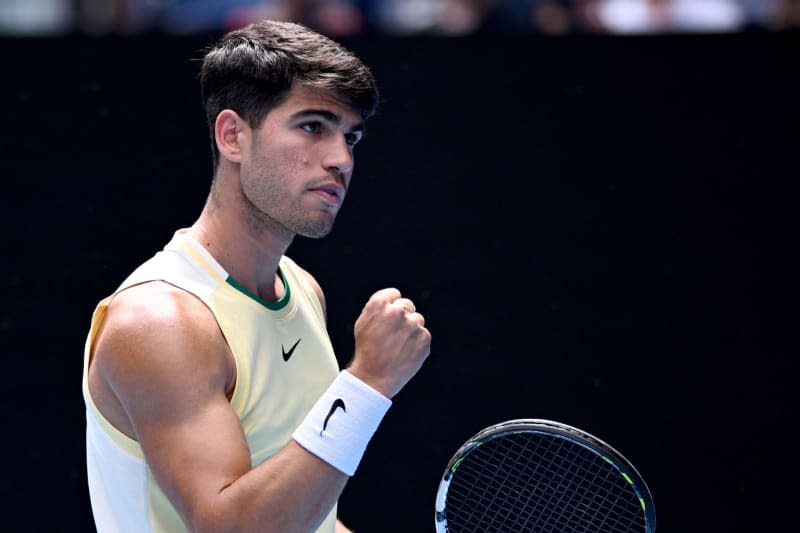 Spanish tennis player Carlos Alcaraz reacts during his men's singles third round tennis match against China's Juncheng Shang at the 2024 Australian Open at Melbourne Park. Joel Carrett/AAP/dpa