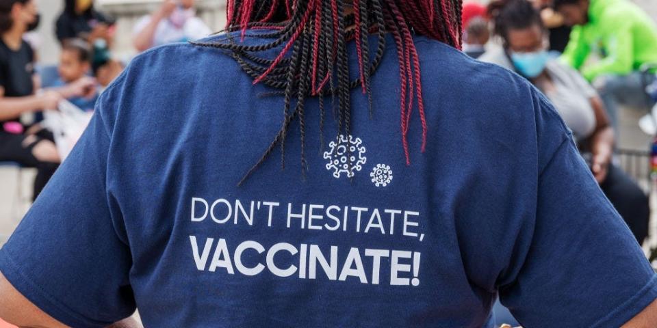 The back of a volunteers shirt advocating for the coronavirus vaccine is seen in Washington, DC, on July 31, 2021.