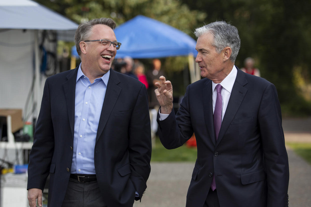 John Williams, left, President and CEO of the Federal Reserve Bank of New York, left, and Jerome Powell, Chairman of the Board of Governors of the Federal Reserve System, right, walk together after Powell's speech at the Jackson Hole Economic Policy Symposium on Friday, Aug. 24, 2018 in Jackson Hole, Wyo. Federal Reserve Chairman Jerome Powell signaled Friday that he expects the Fed to continue gradually raising interest rates if the U.S. economic expansion remains strong. (AP Photo/Jonathan Crosby)