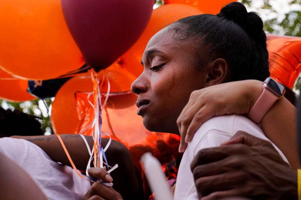 Ayana Mosley, Khalil Amari Allen's sister, cries while listening to speakers at a vigil honoring Allen, 18, in Southfield on Friday, July 14, 2023. Allen was shot and killed while driving to get food the evening of July 11.