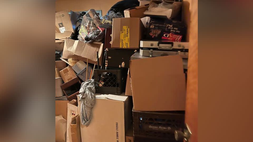Boxes were piled up inside the home after the search, leaving the family little room to move. - Courtesy Robert Macedonio
