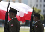 Polish soldiers stand at attention during ceremonies marking the centennial of the Battle of Warsaw, a Polish military victory in 2020 that stopped the Russian Bolshevik march toward the west, in Warsaw, Poland, Saturday Aug. 15, 2020. Pompeo attended as he wrapped up a visit to central Europe.(AP Photo/Czarek Sokolowski)