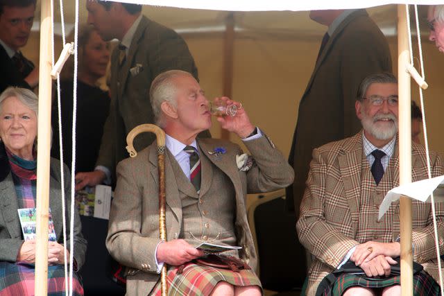 <p>Robert MacDonald/PA Images via Getty Images</p> Charles sipped whisky at the Mey Highland Games