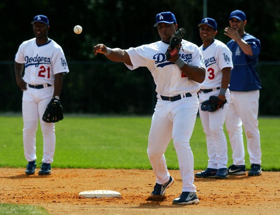 Dodgers' third-baseman Adrian Beltre turns a double-play during infield practice Thursday, February 20, 2003, on Field 1 at Dodgertown in Vero Beach.