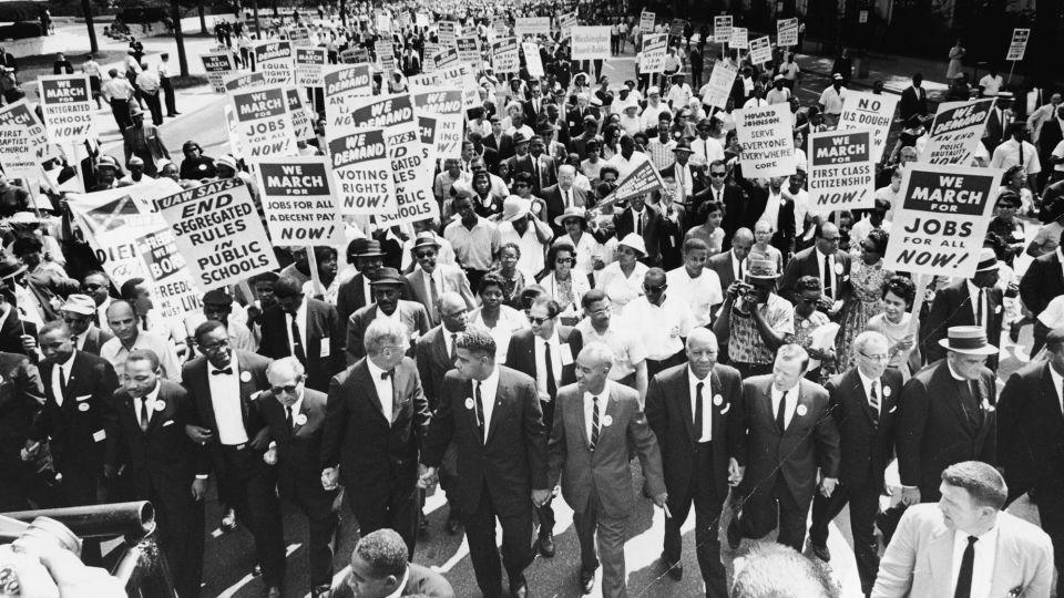 The March on Washington for Jobs and Freedom on August 28, 1963. Those in attendance include (front row): James Meredith and Martin Luther King, Jr., left; (L-R) Roy Wilkins, light-colored suit, A. Phillip Randolph, and Walther Reuther. - Express Newspapers/Hulton Archive/Getty Images