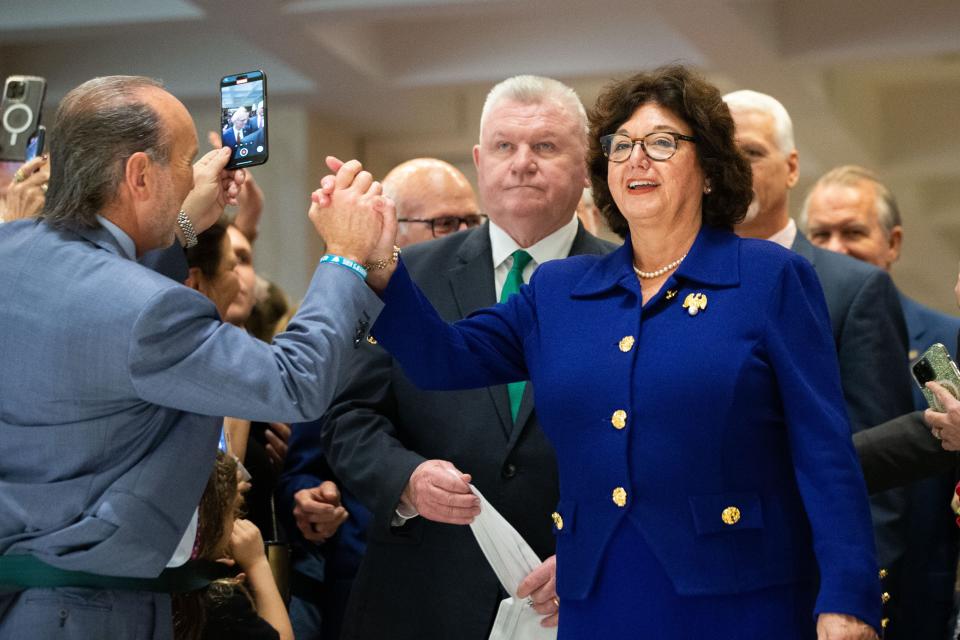 Senate President Kathleen Passidomo high-fives someone as she enters the fourth floor Capitol rotunda for the traditional sine die hanky drop on Friday, March 8, 2024.