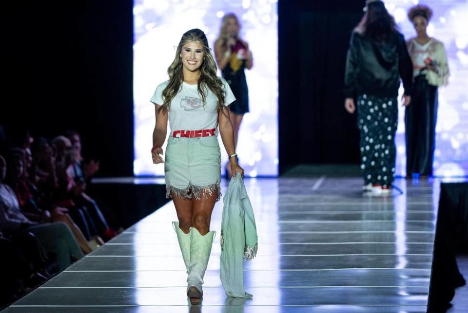 Ava Hunt models Chiefs clothing during the 12th annual Chiefs Style Lounge on Tuesday, Oct. 17, 2023, in Kansas City.